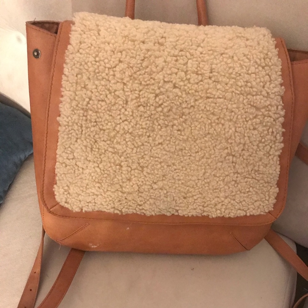 Leather back pack with faux fur detail